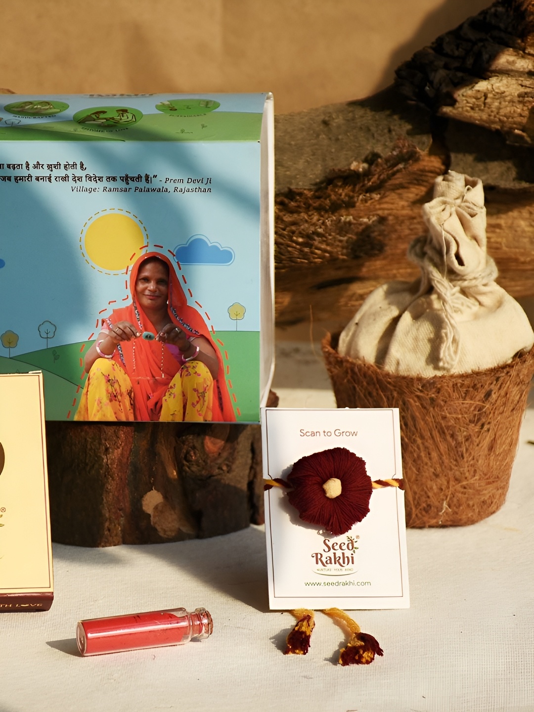 

Indigifts Cotton Rakhi With Planter & Roli Chawal, Red