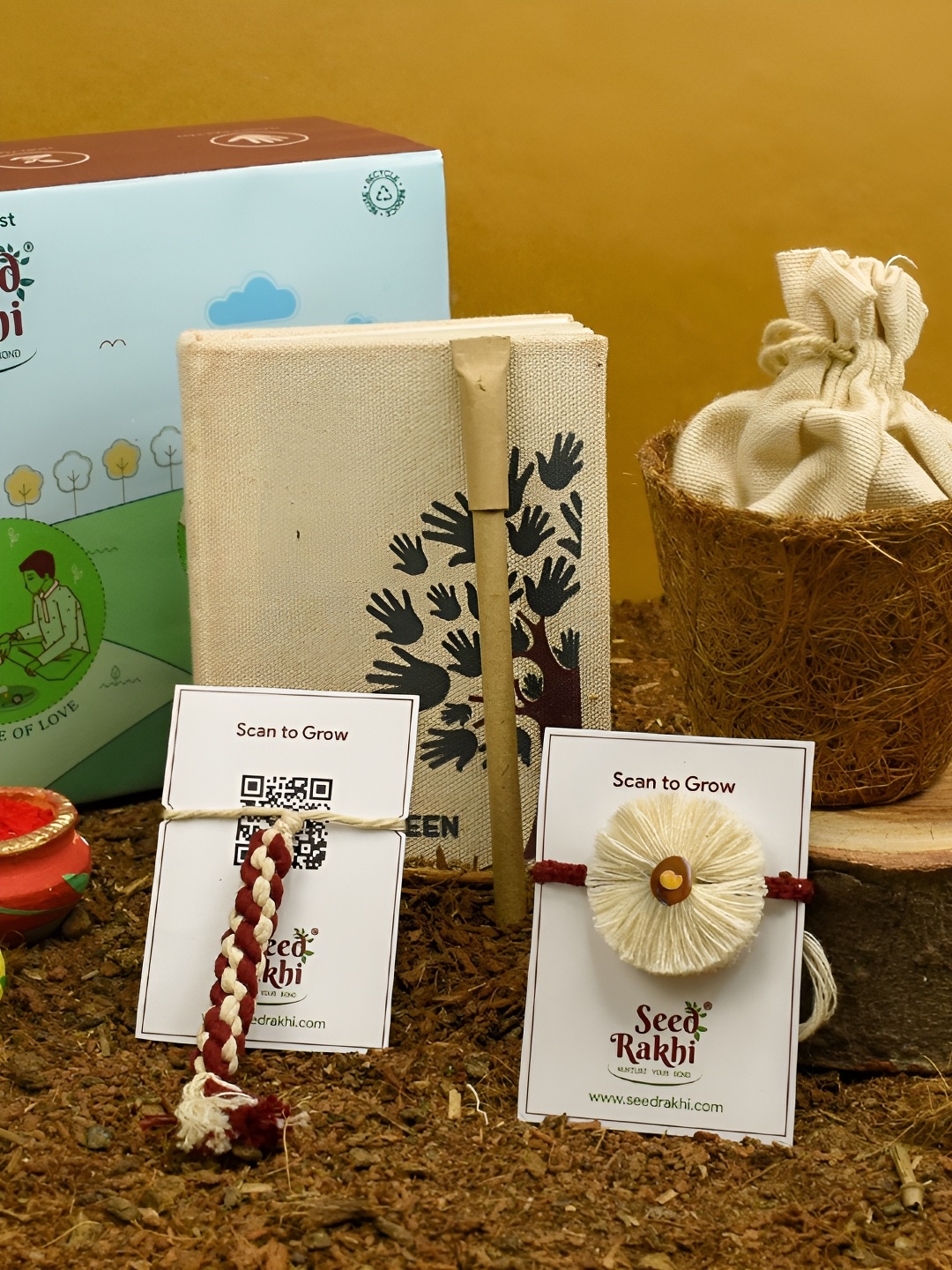 

Indigifts Set Of 2 Seed Plantable Rakhi With Planter & Diary Pen, White