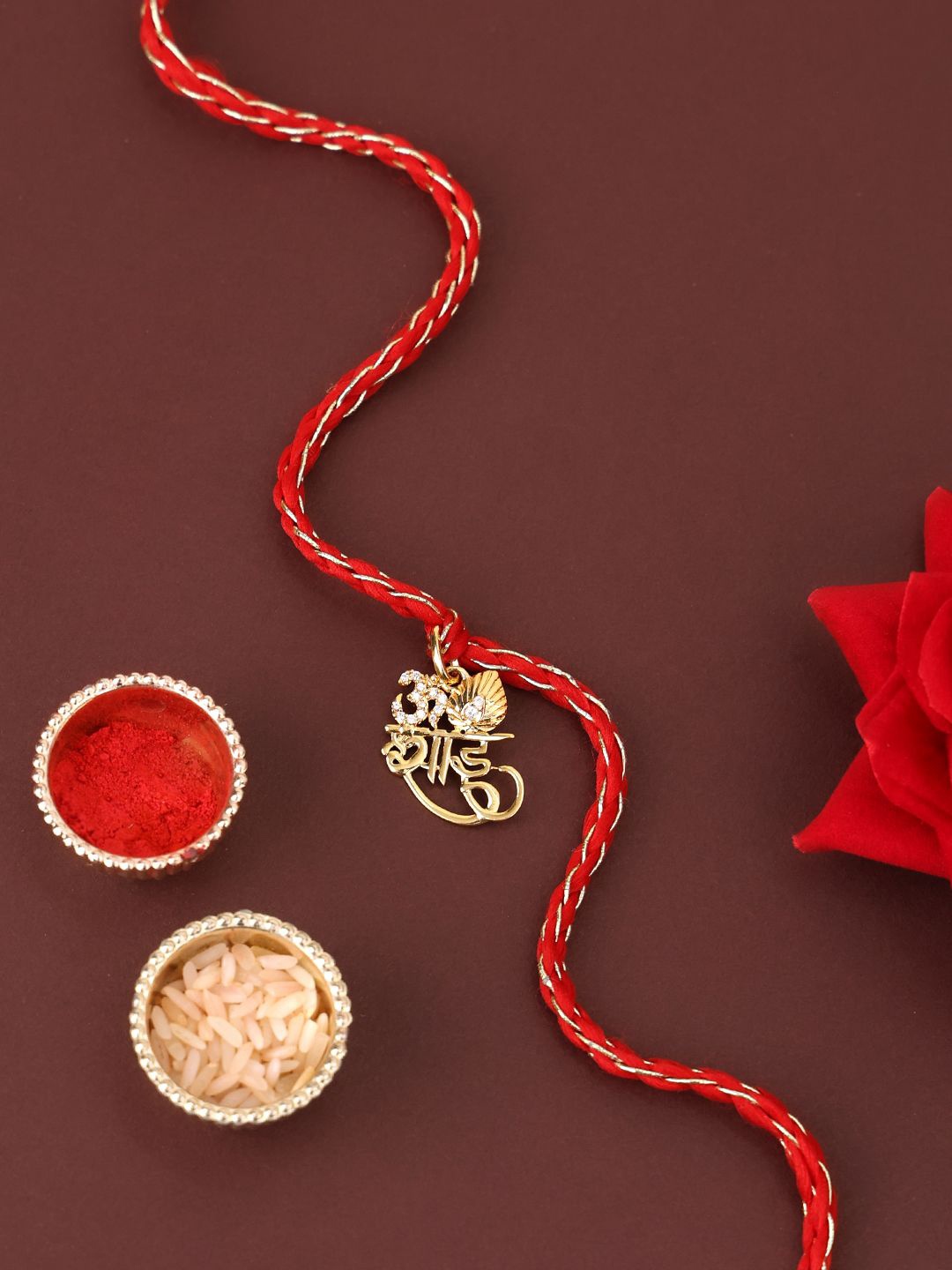

PANASH 925 Sterling Gold -Plated Om Shaped CZ Stone Studded Rakhi With Roli Chawal