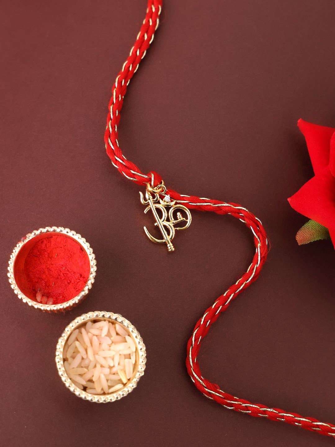 

PANASH 925 Sterling Gold -Plated Om Shaped CZ Stone Studded Rakhi With Roli Chawal