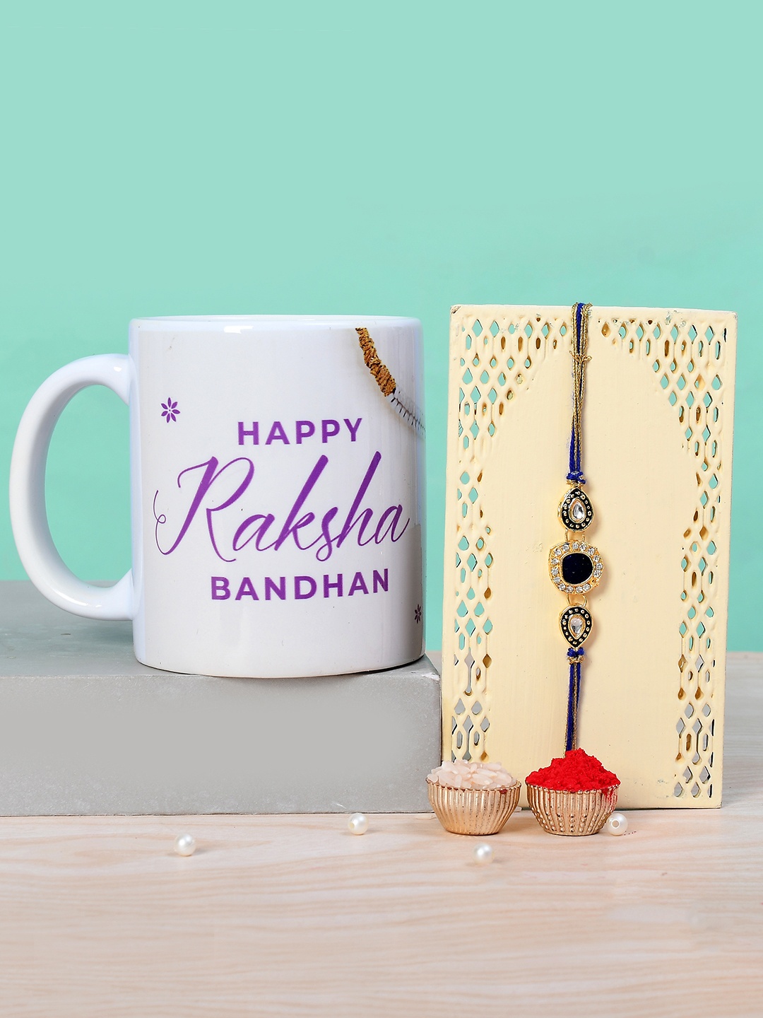 

Voylla Set Of 2 Stone Studded Thread Rakhi With Mug & Roli Chawal, Blue