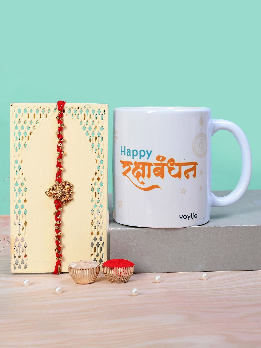 

Voylla Set of 2 Ganesha Thread Rakhi With Mug & Roli Chawal, White