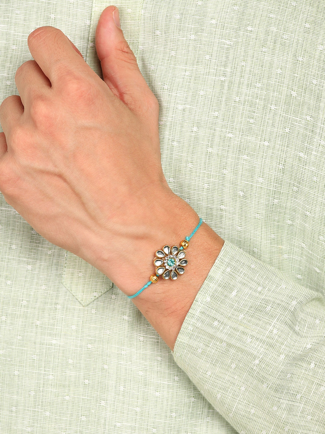 

Nanwan Assorted Thread Rakhi with Artificial Stones & Beads