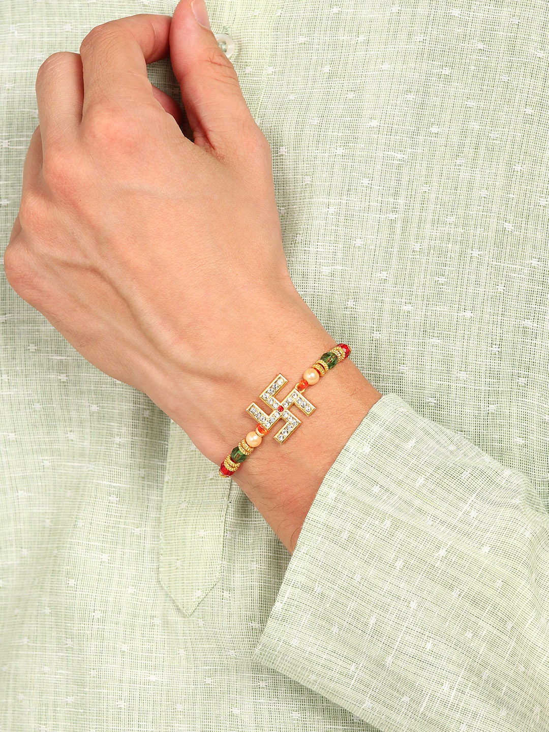 

Nanwan Assorted Swastik & Artifical Stones And BeadsThread Rakhi