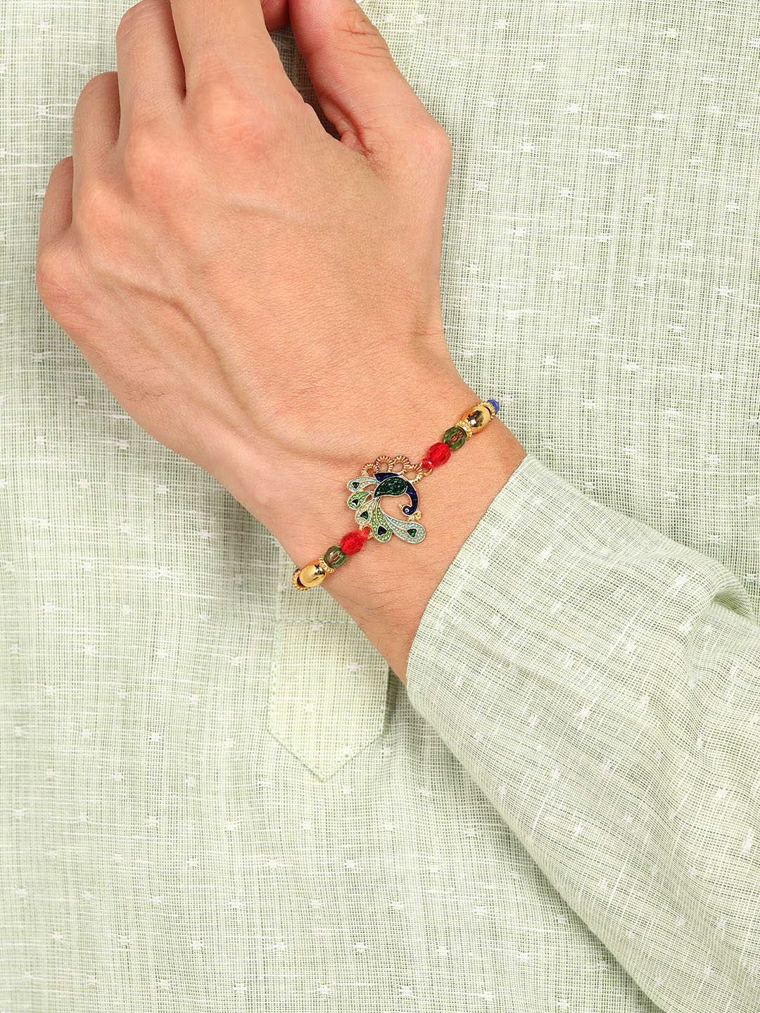 

Nanwan Assorted Peachock Themed Artifical Beads Thread Rakhi