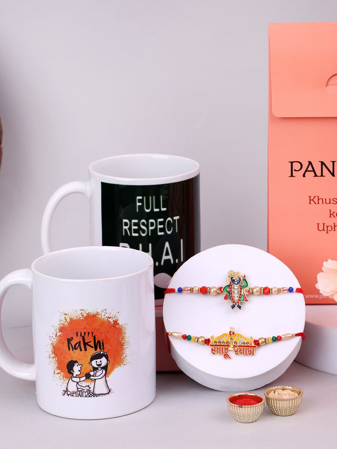 

PANASH Set Of 4 Gold Plated Beads & Stone Studded Rakhis With Printed Mugs & Roli Chawal