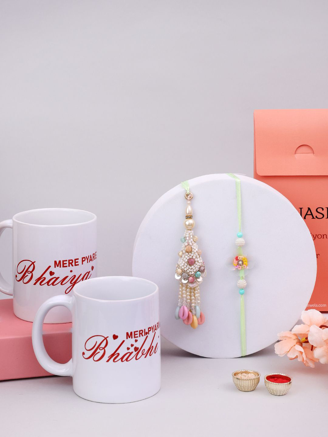 

PANASH Set Of 4 Gold Plated Rakhis With Mugs & Roli Chawal