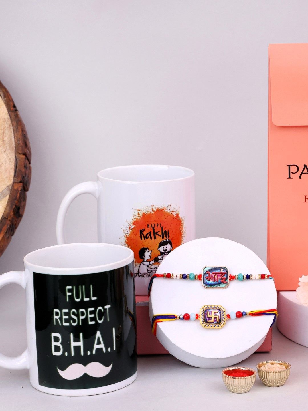 

PANASH Set Of 4 Gold-Plated Rakhi With Printed Mugs & Roli Chawal