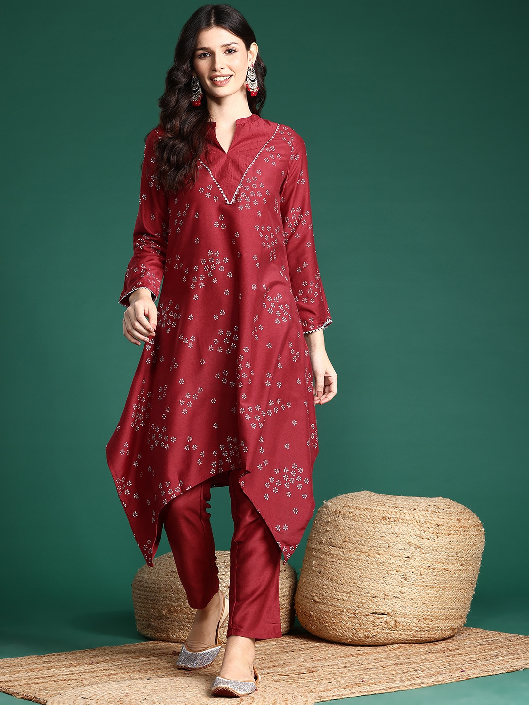 

Sangria Foil Printed Ethnic Motifs Printed Gotta Patti Asymmetric Kurta with Trousers, Maroon