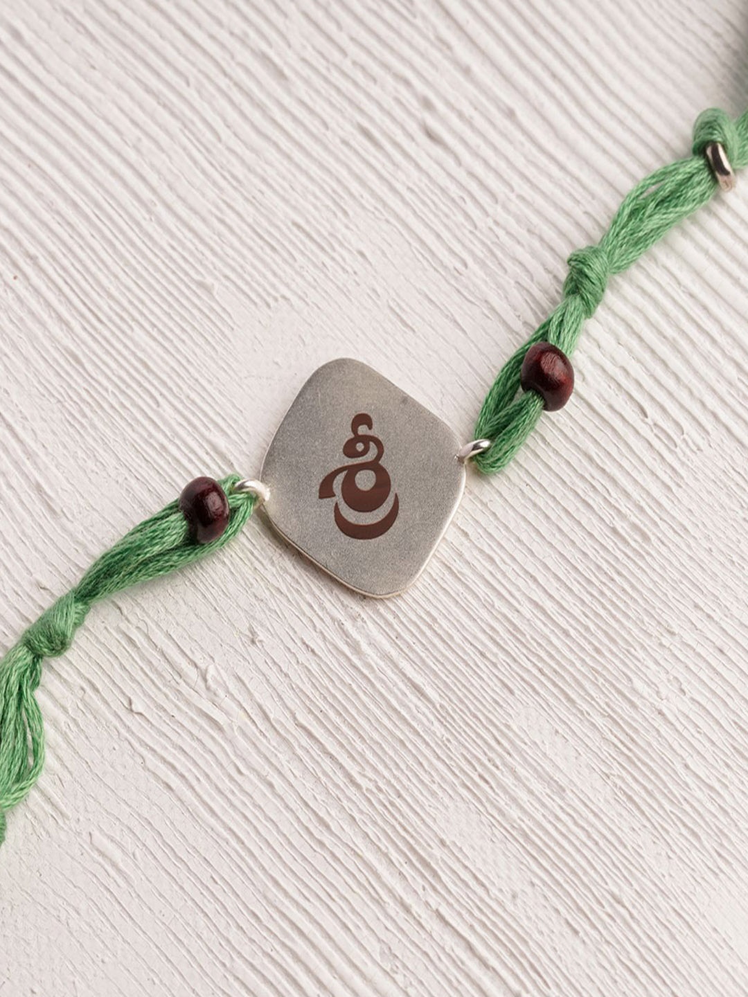 

Suhani Pittie Thread Rakhi, Green
