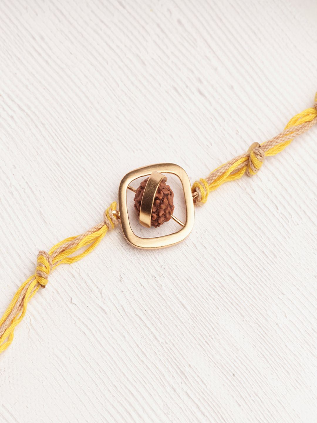 

Suhani Pittie Thread Rakhi, Yellow
