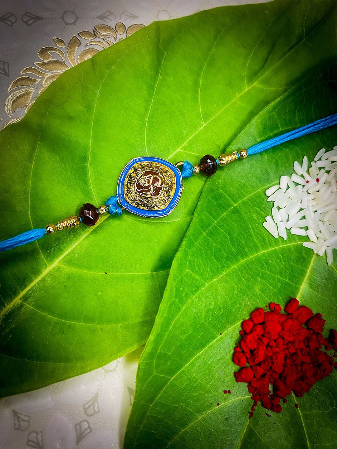 

Mahi Enamel Om Thread Rakhi With Roli Chawal, Blue