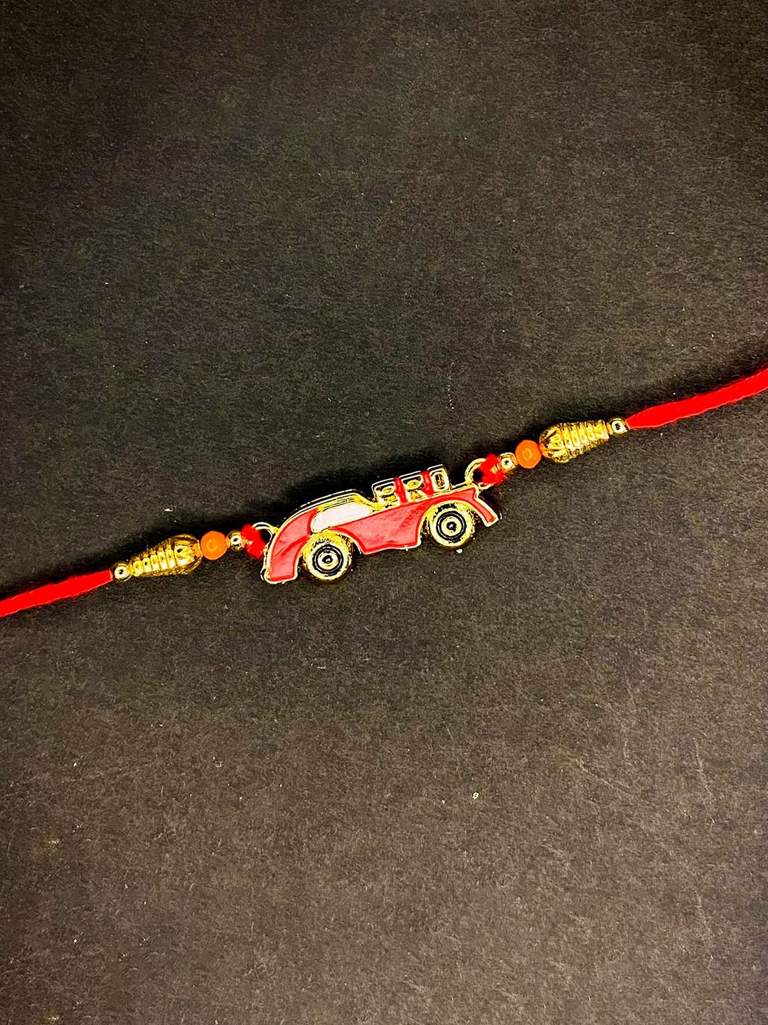 

Mahi Meenakari Work Super Car Thread Rakhi, Red
