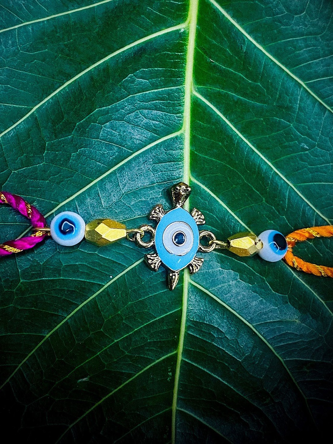 

Mahi Evil Eye & Tortoise-Shaped Thread Rakhi, Blue