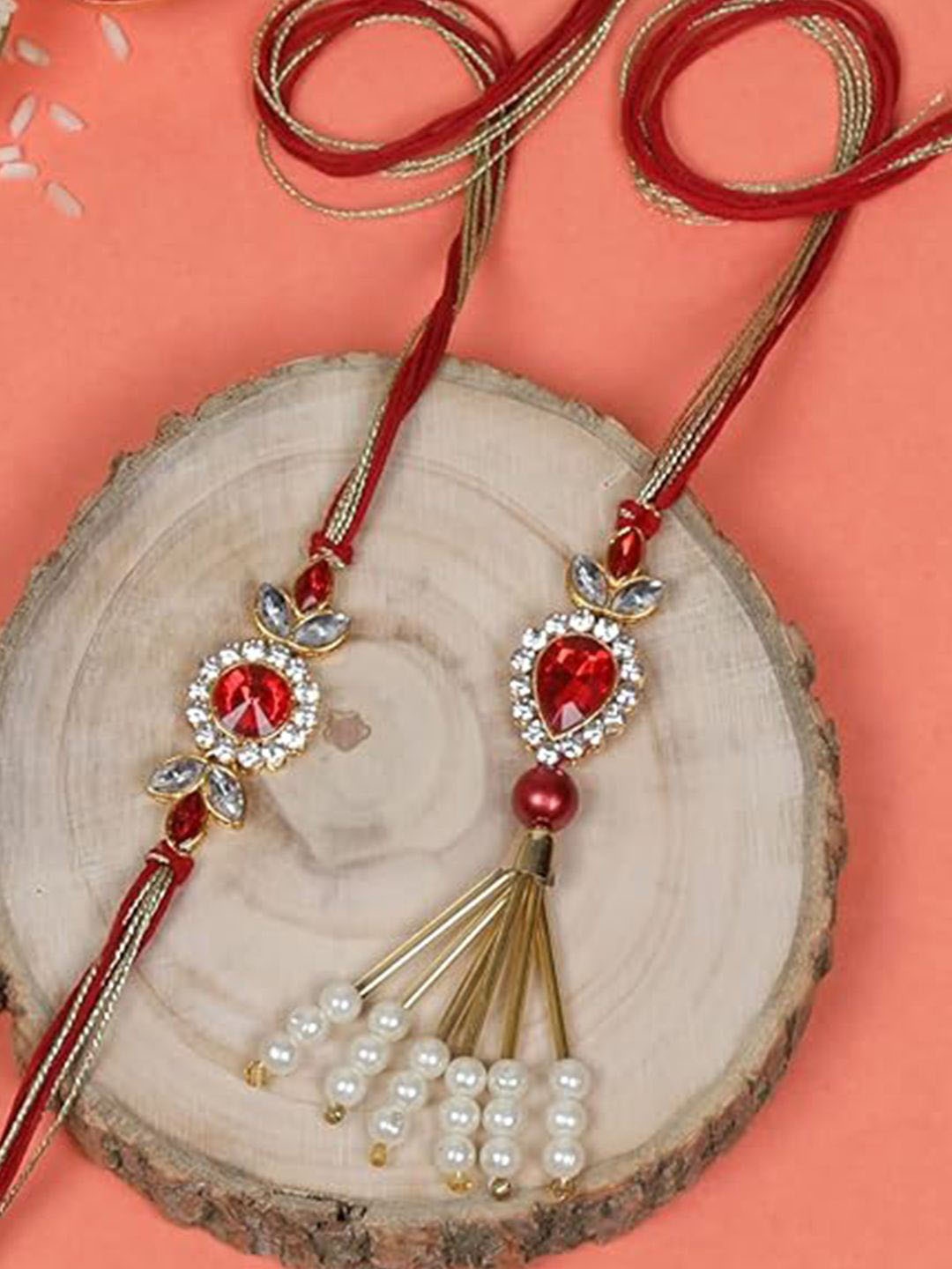 

Kaameri Bazaar Set Of 2 Stone Studded & Beaded Thread Rakhi, Red