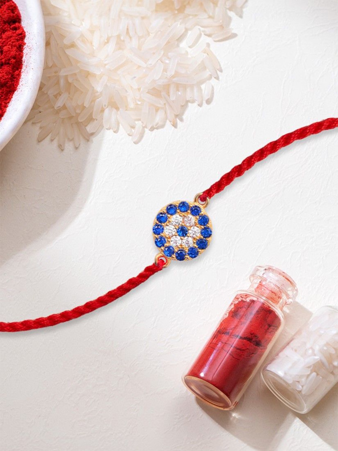 

Zavya 925 Sterling Silver Gold-Plated Cubic Zirconia Blue CZ Studded Rakhi