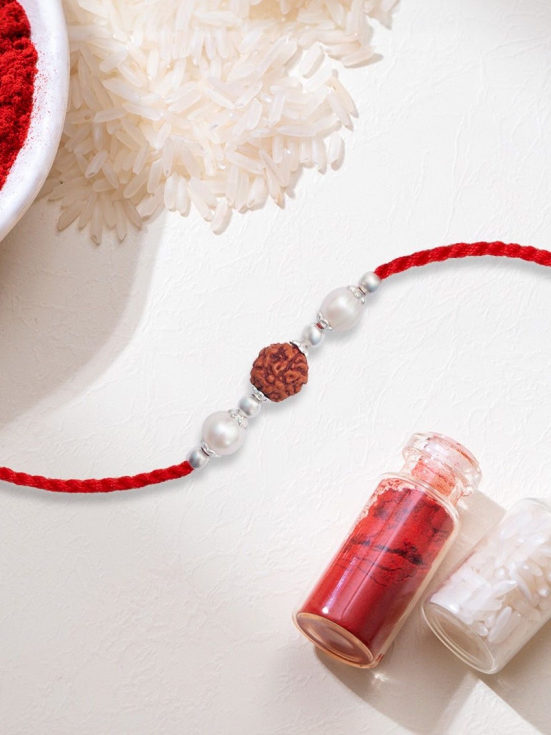 

Zavya 925 Sterling Silver Pearl Threaded Rakhi, Rice & Roli Set