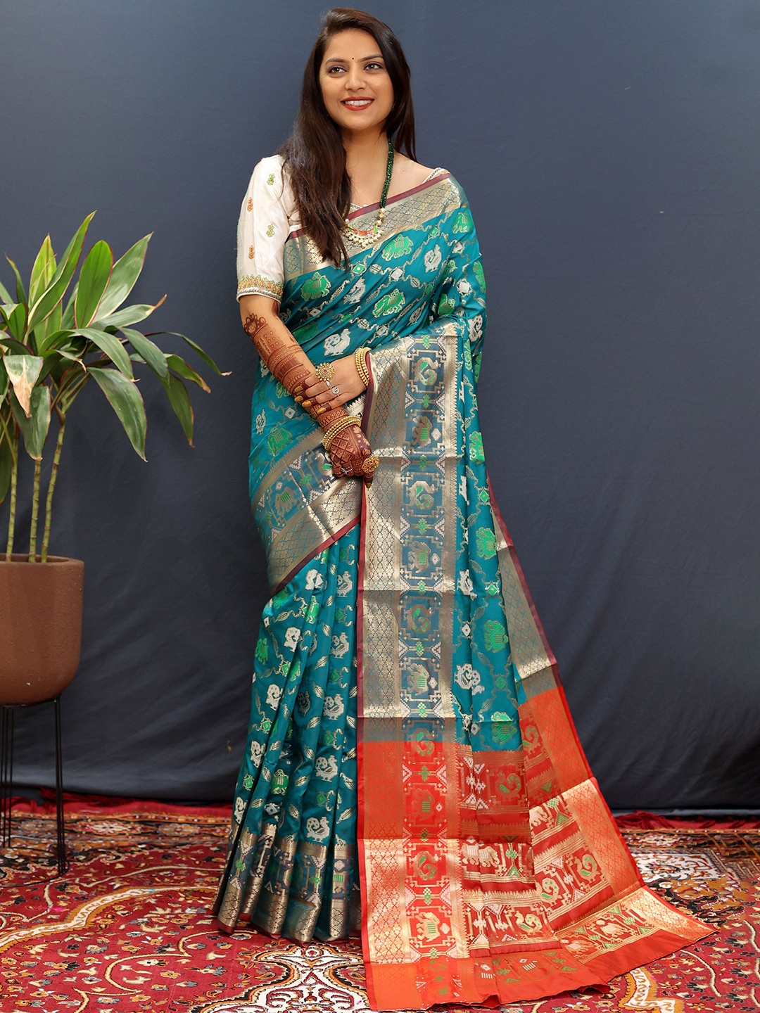 

Mitera Ethnic Motifs Zari Woven Designed Patola Saree, Turquoise blue