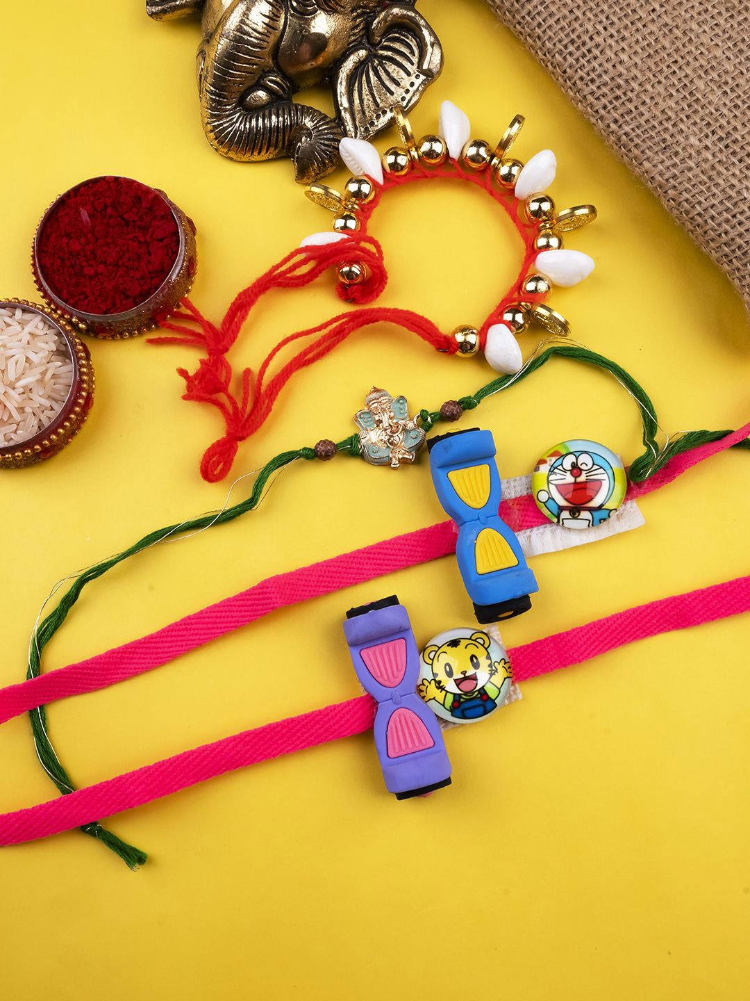 

StileAdda Set Of 4 Beaded Thread Rakhis With Roli & Chawal With Chandan And Mishri, Red