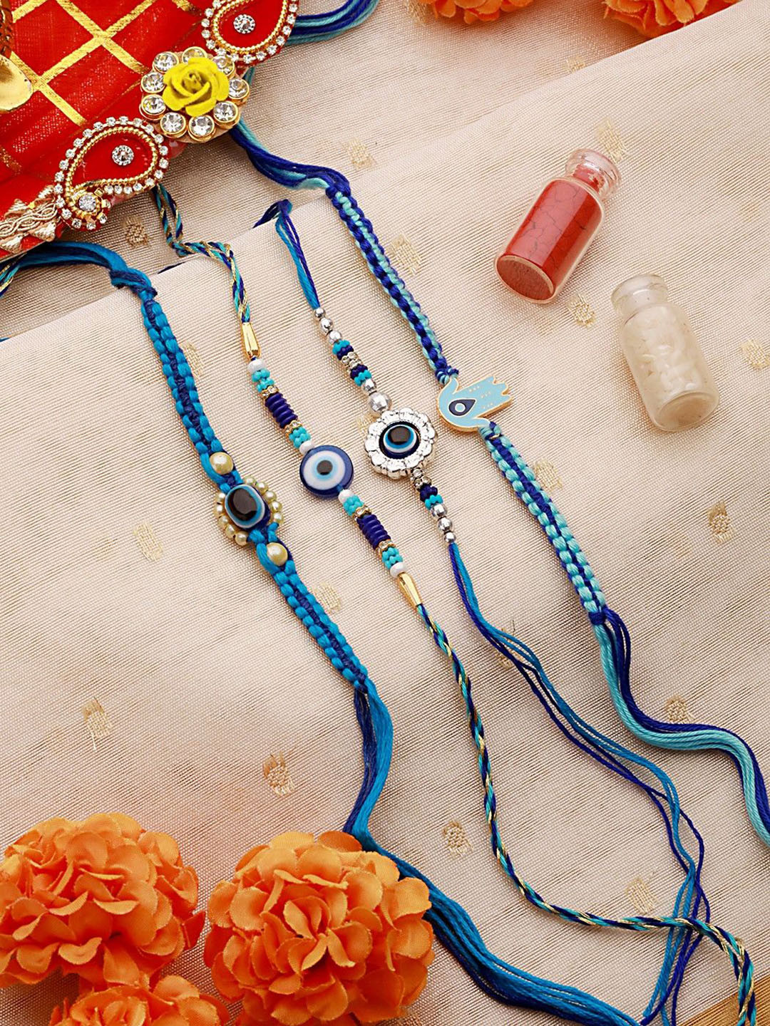 

Jazz and Sizzle Set Of 4 Faux Pearl Beaded Evil-Eye Rakhis with Roli & Chawal, Blue