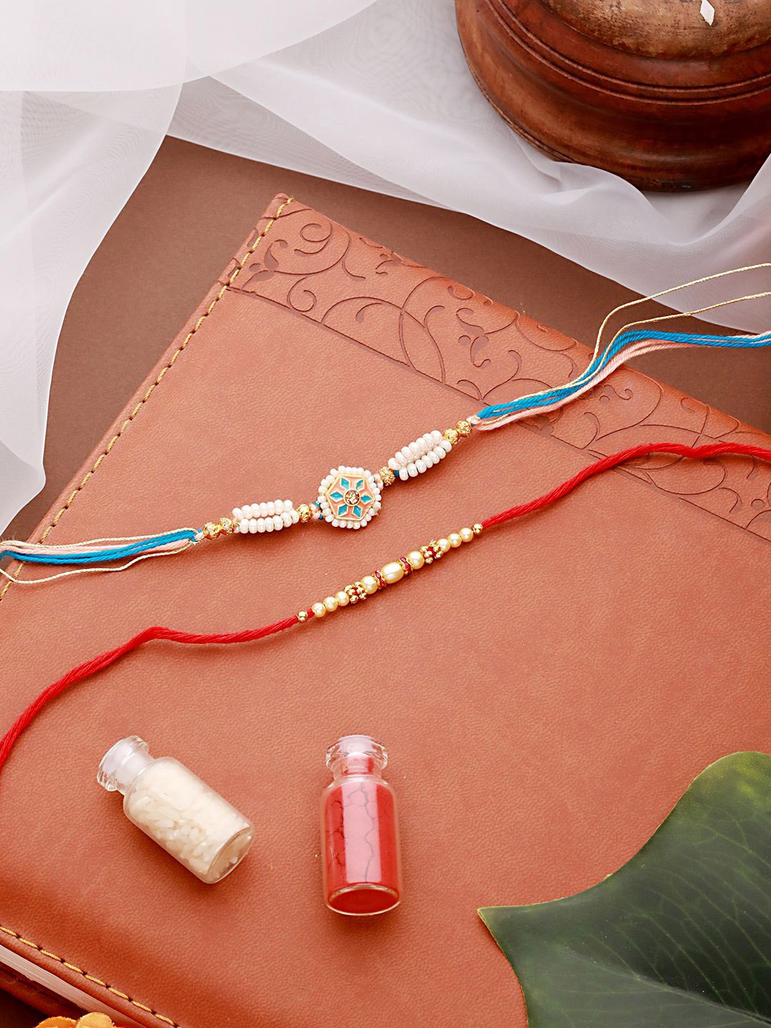 

Jazz and Sizzle Set of 2 Faux Pearls Beaded & Enamelled Thread Rakhi with Roli & Chawal, Pink