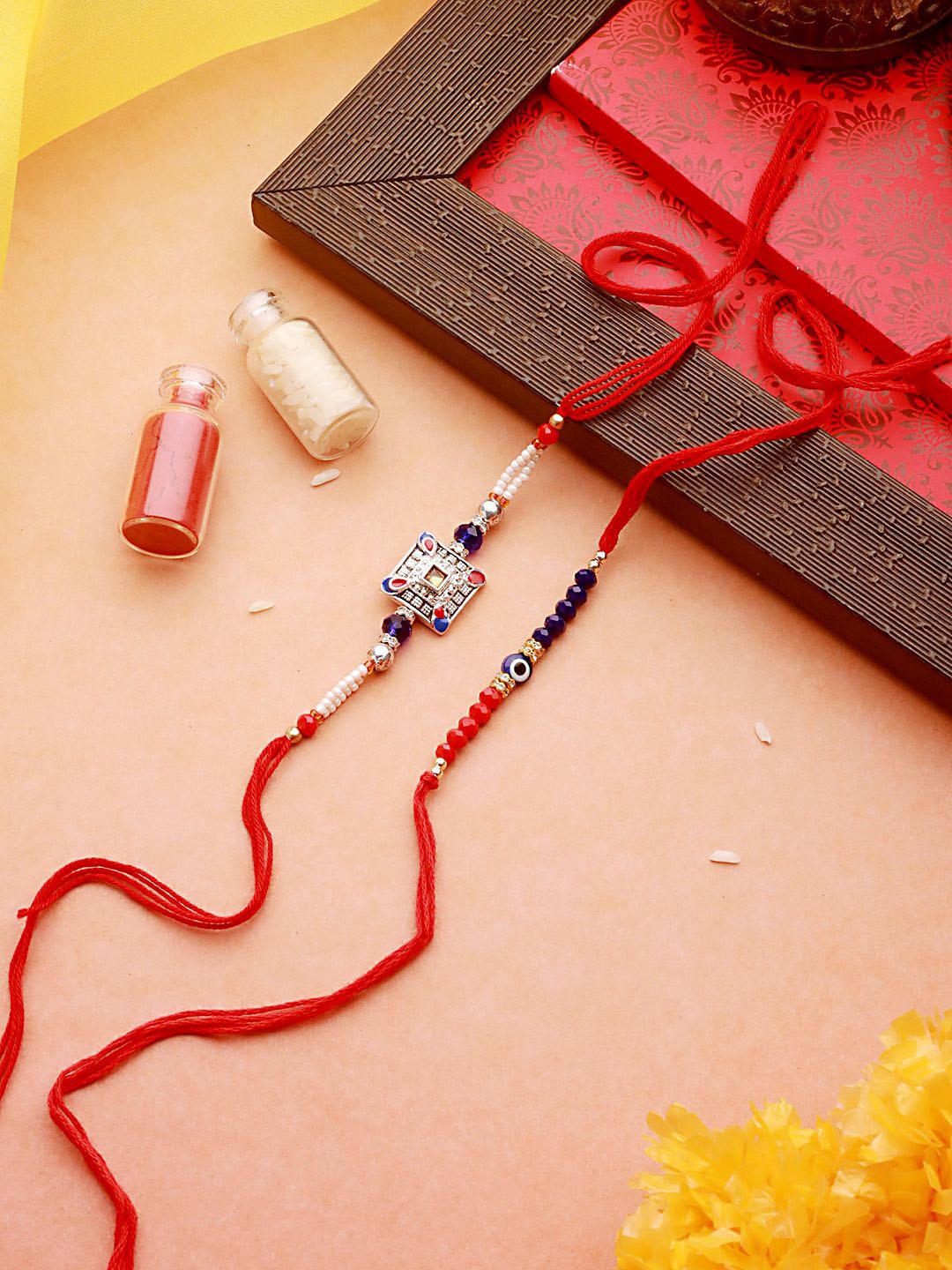 

Jazz and Sizzle Set of 2 Stone Studded & Beaded Rakhi With Roli Chawal, Blue