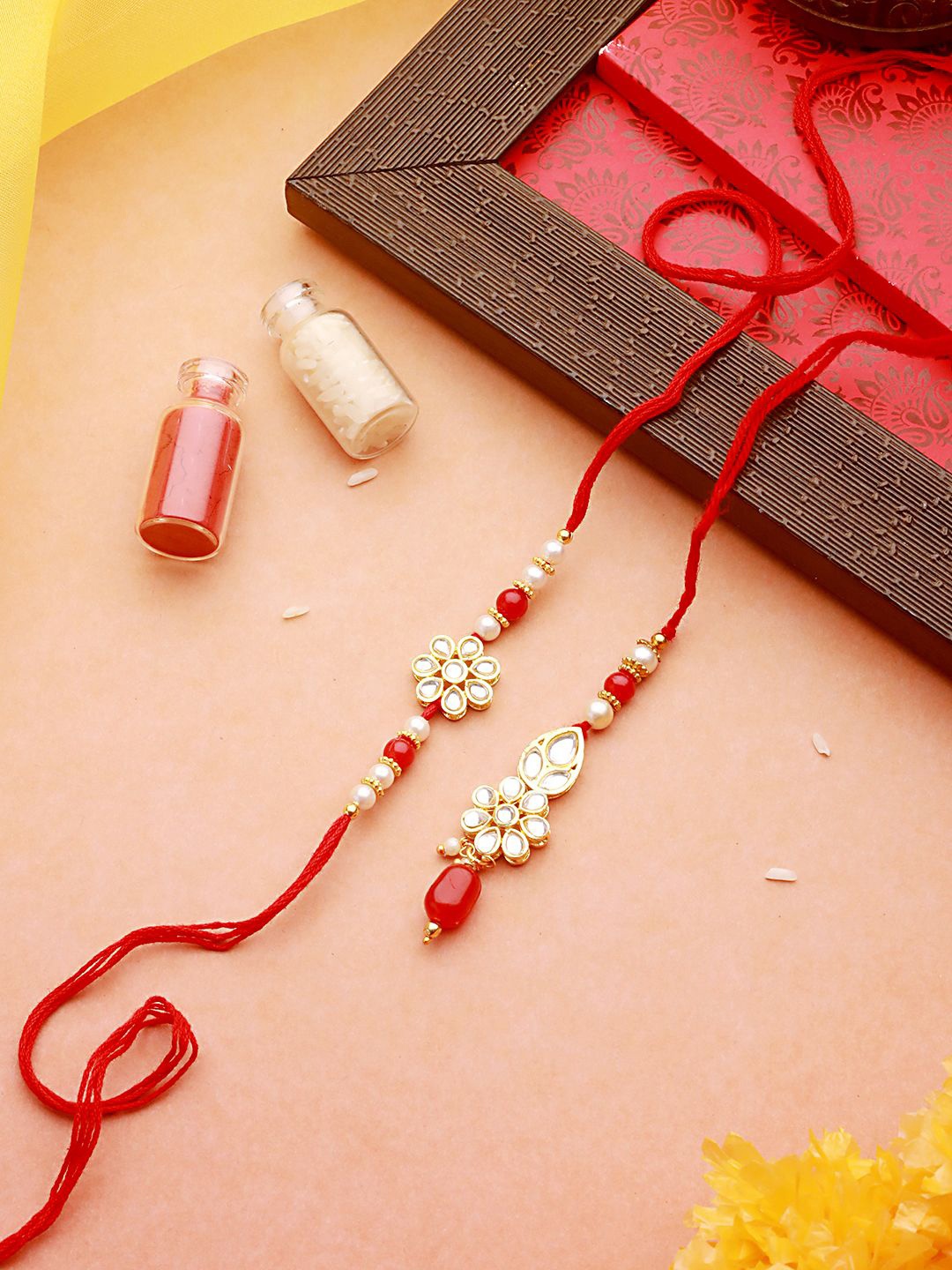 

Jazz and Sizzle Kundan Studded Thread Bhaiya Bhabhi Rakhis with Roli Chawal, Gold