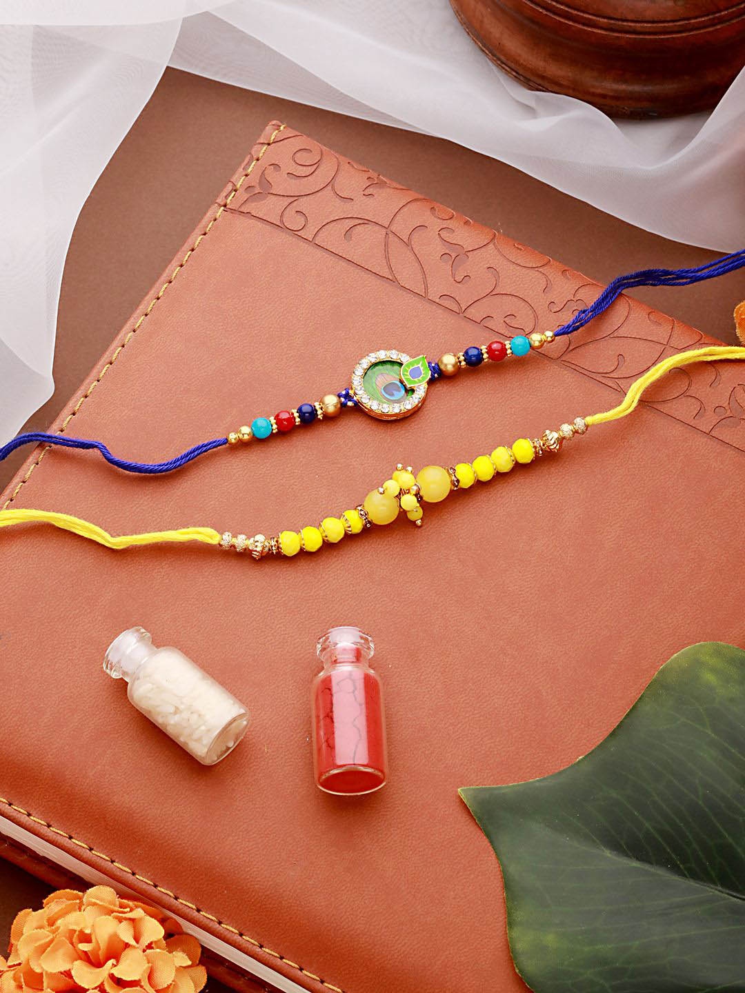 

Jazz and Sizzle Set Of 2 Pearl Beaded Thread Rakhis with Roli Chawal, Yellow