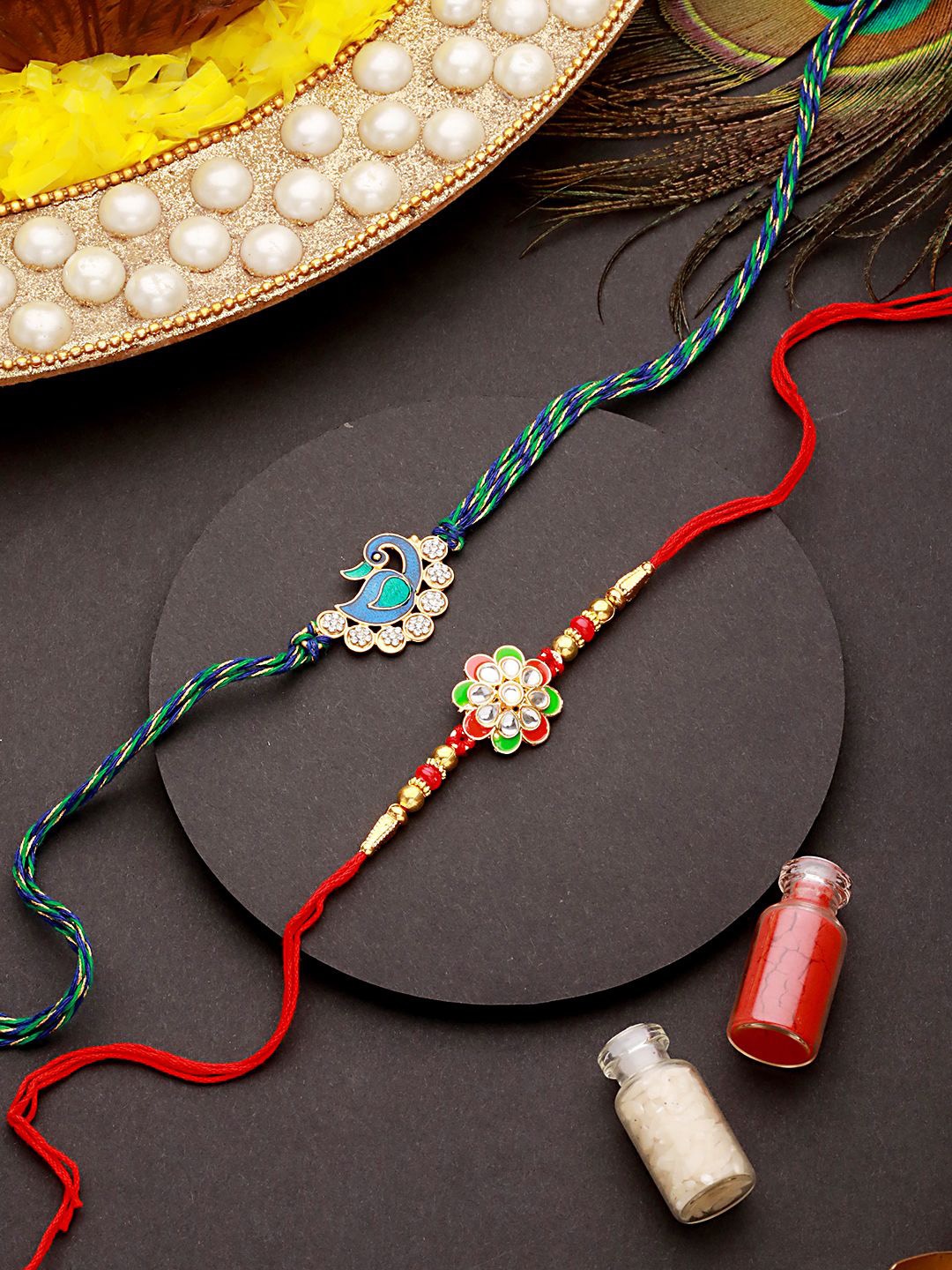 

Jazz and Sizzle Set Of 2 CZ Studded Thread Rakhis with Roli Chawal, Gold