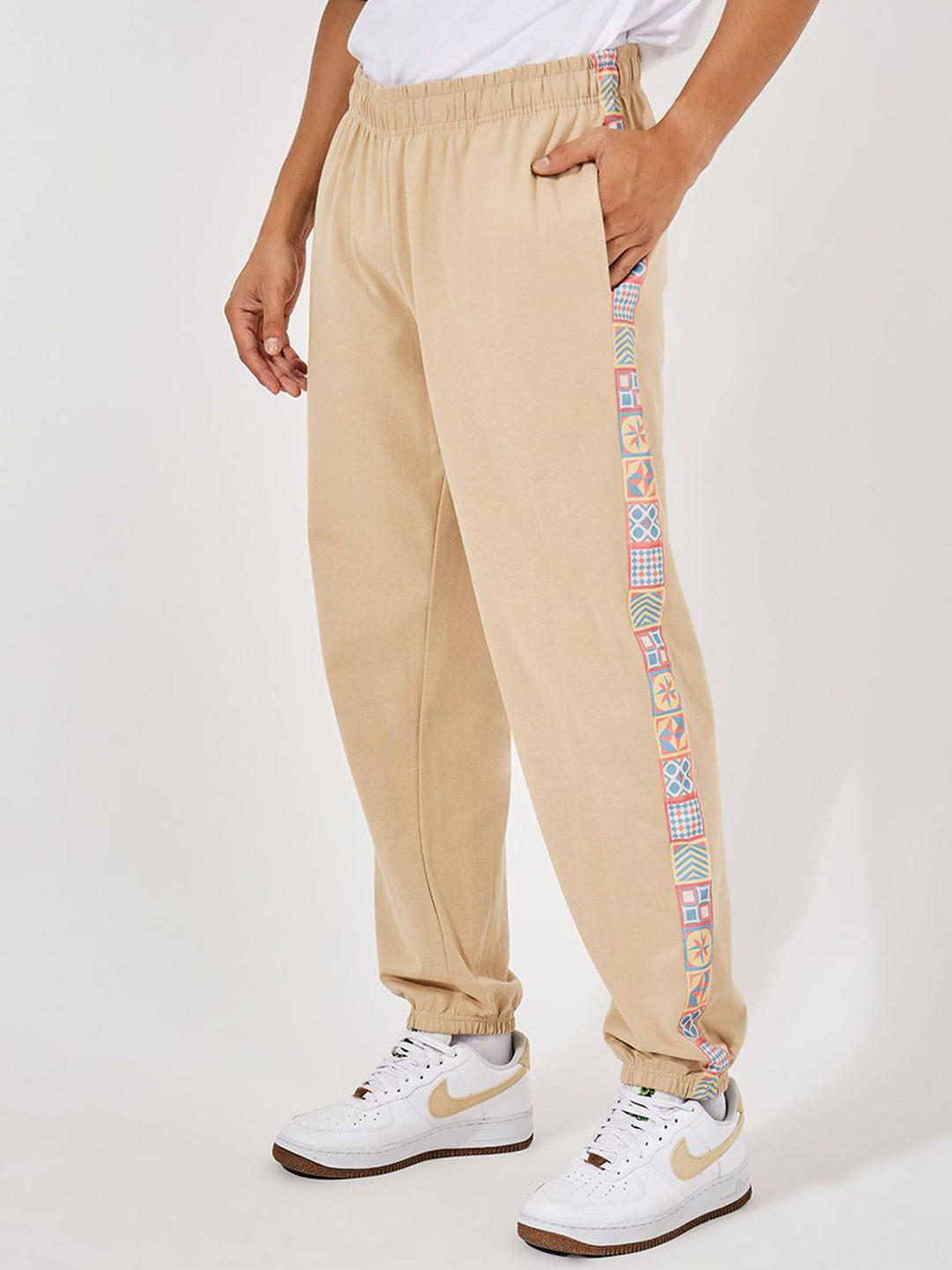 

Styli Men Side Motif Print Relaxed Fit Joggers, Beige