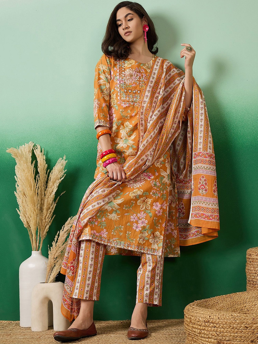 

Vastramyaa Floral Printed Thread Work Pure Cotton Straight Kurta With Trousers & Dupatta, Mustard