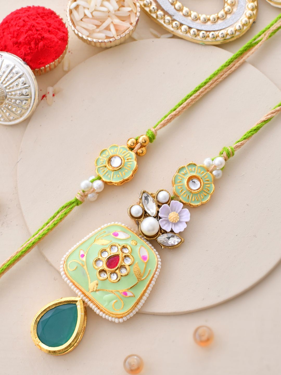 

Aapno Rajasthan Bhaiya Bhabhi Kundan Studded Rakhi With Beautiful Box & Roli Chawal, Green