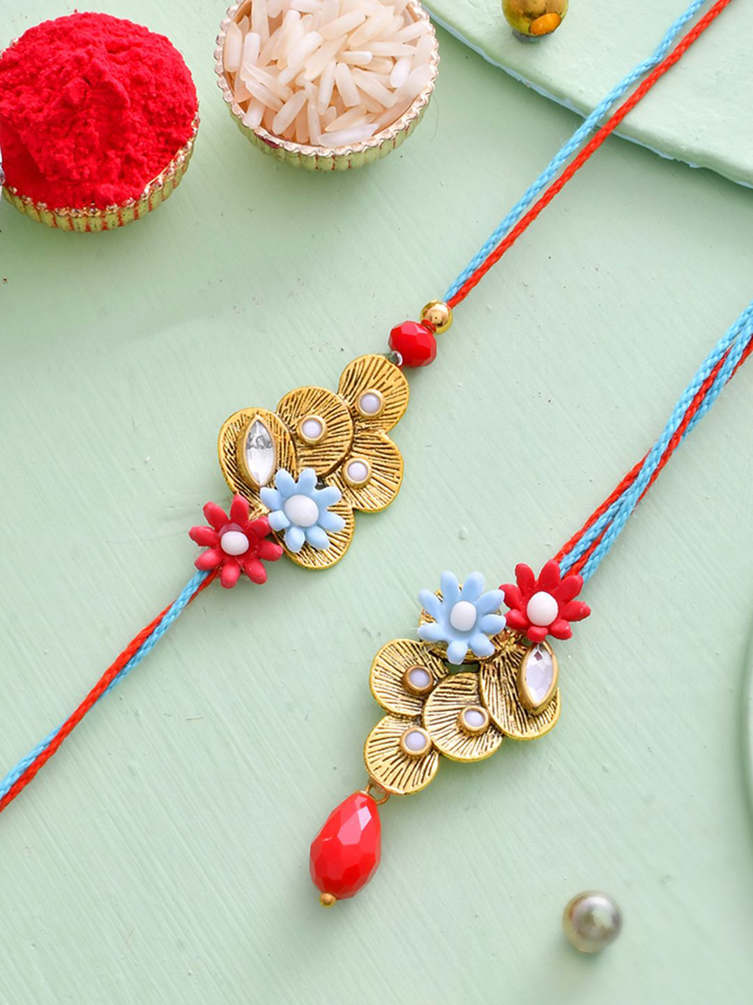 

Aapno Rajasthan Floral Beaded Bhaiya Bhabhi Rakhi Set with Box, Red