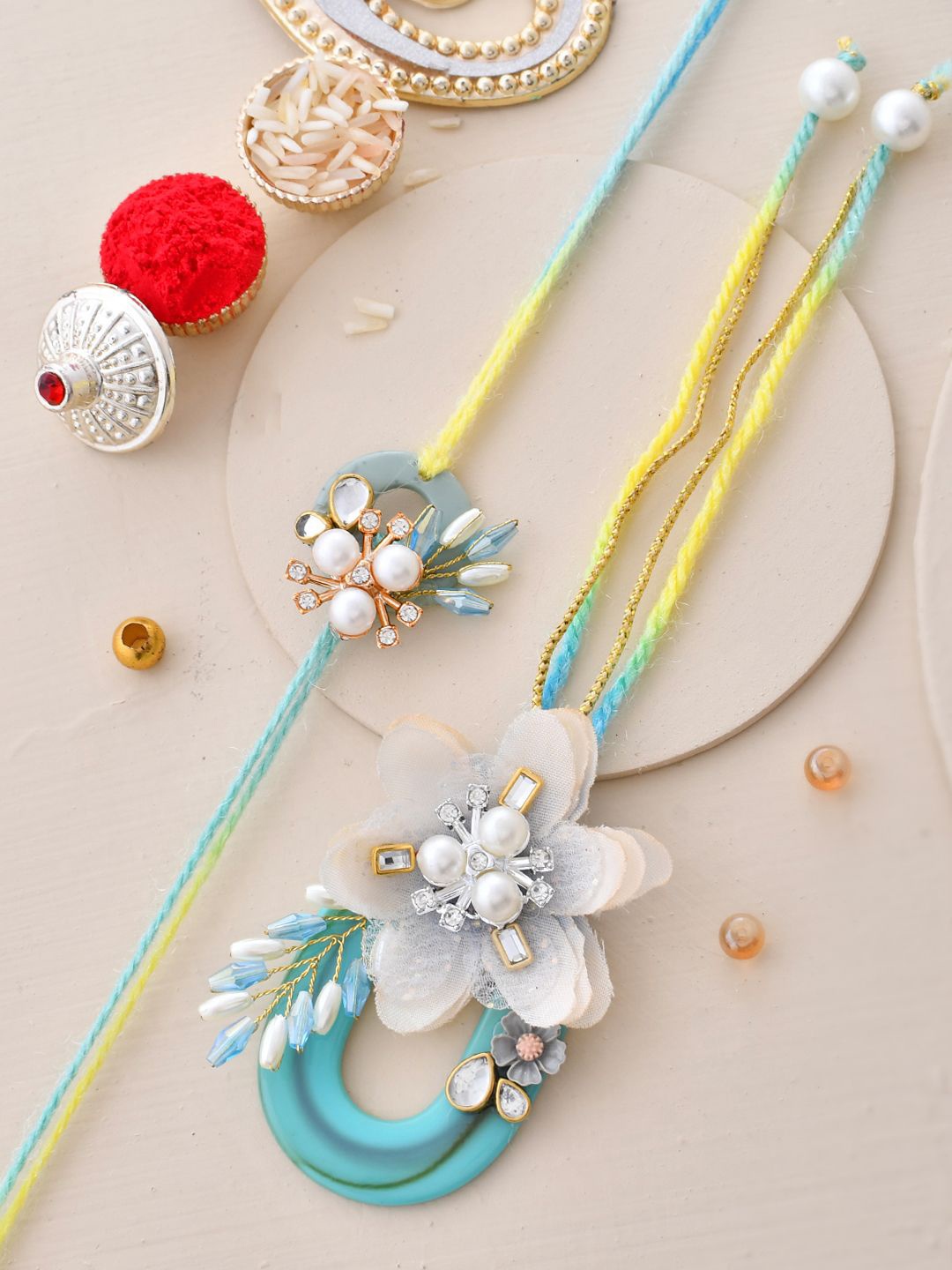 

Aapno Rajasthan Pearl-Beaded Floral-Shaped Bhaiya Bhabhi Rakhi with Box, Gold