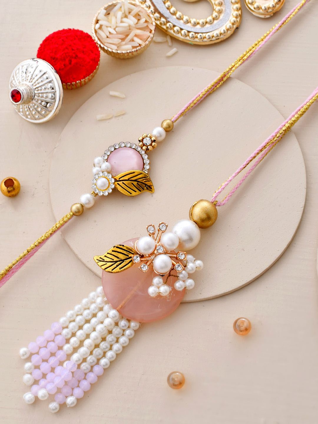 

Aapno Rajasthan Bhaiya Bhabhi Stone Studded Rakhi With Beautiful Box & Roli Chawal, Pink