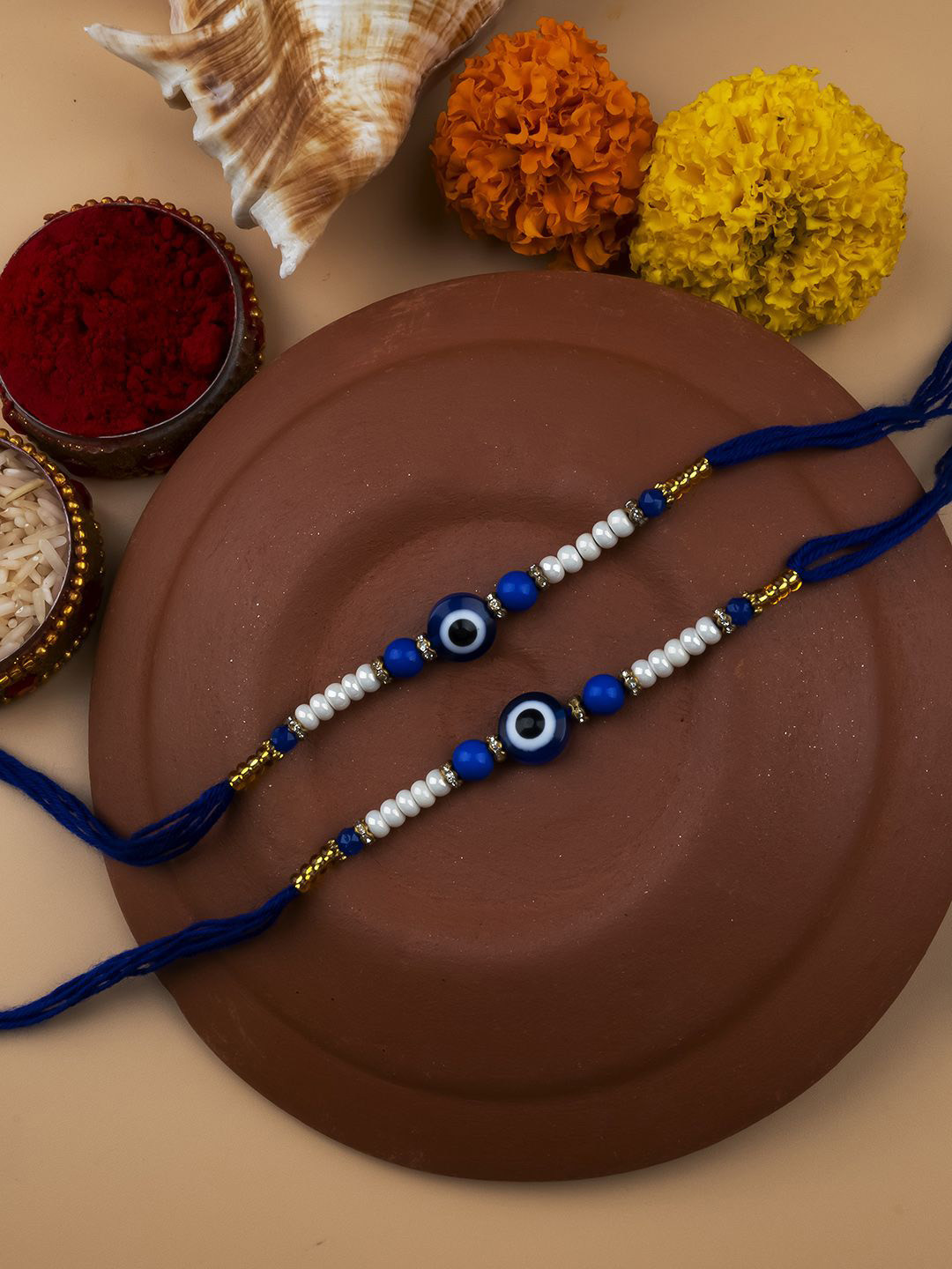 

StileAdda Set of 2 Bhai Bhabhi Evil Eye Beaded Thread Rakhis With Roli Chawal, Blue
