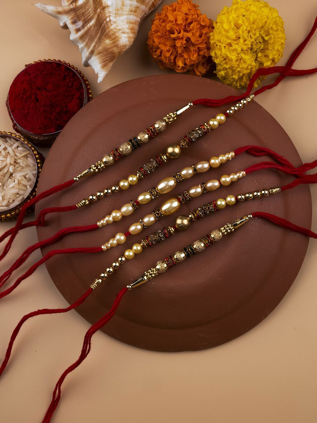 

StileAdda Set Of 6 Beaded Thread Rakhis With Roli & Chawal With Chandan And Mishri, Gold