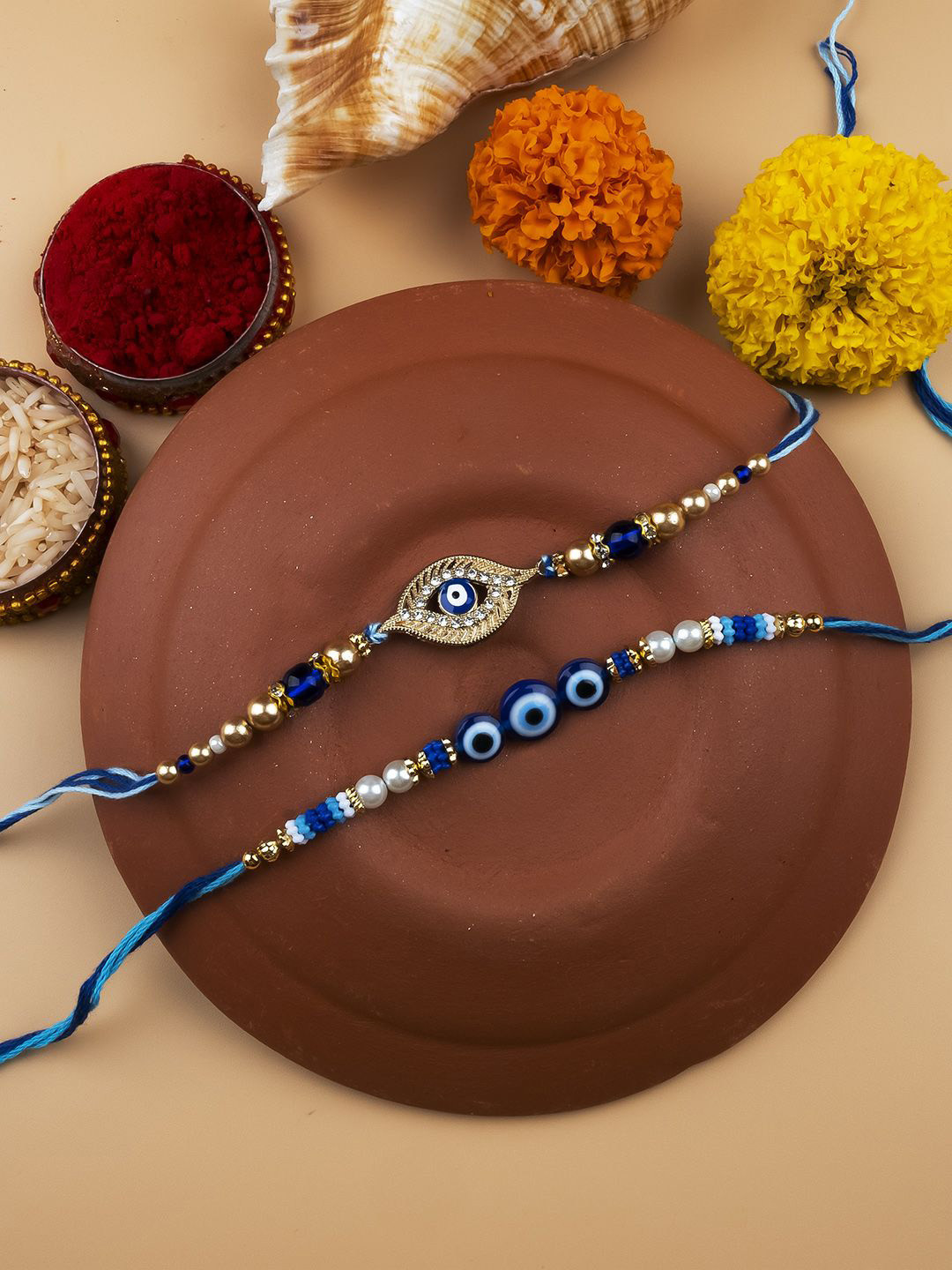 

StileAdda Set of 2 Evil Eye Beaded Thread Rakhis With Roli Chawal, Blue