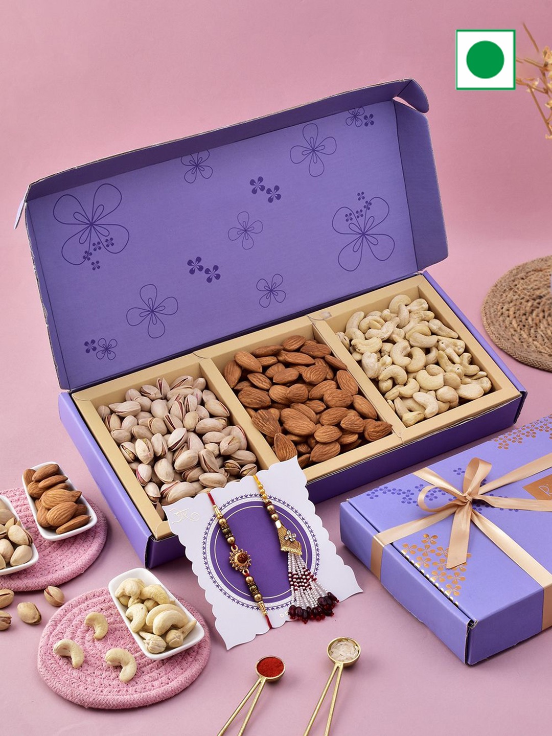 

RawFruit Set Of Floral Charm Rakhis With Roli Chawal & DryFruit Gift Set, Purple