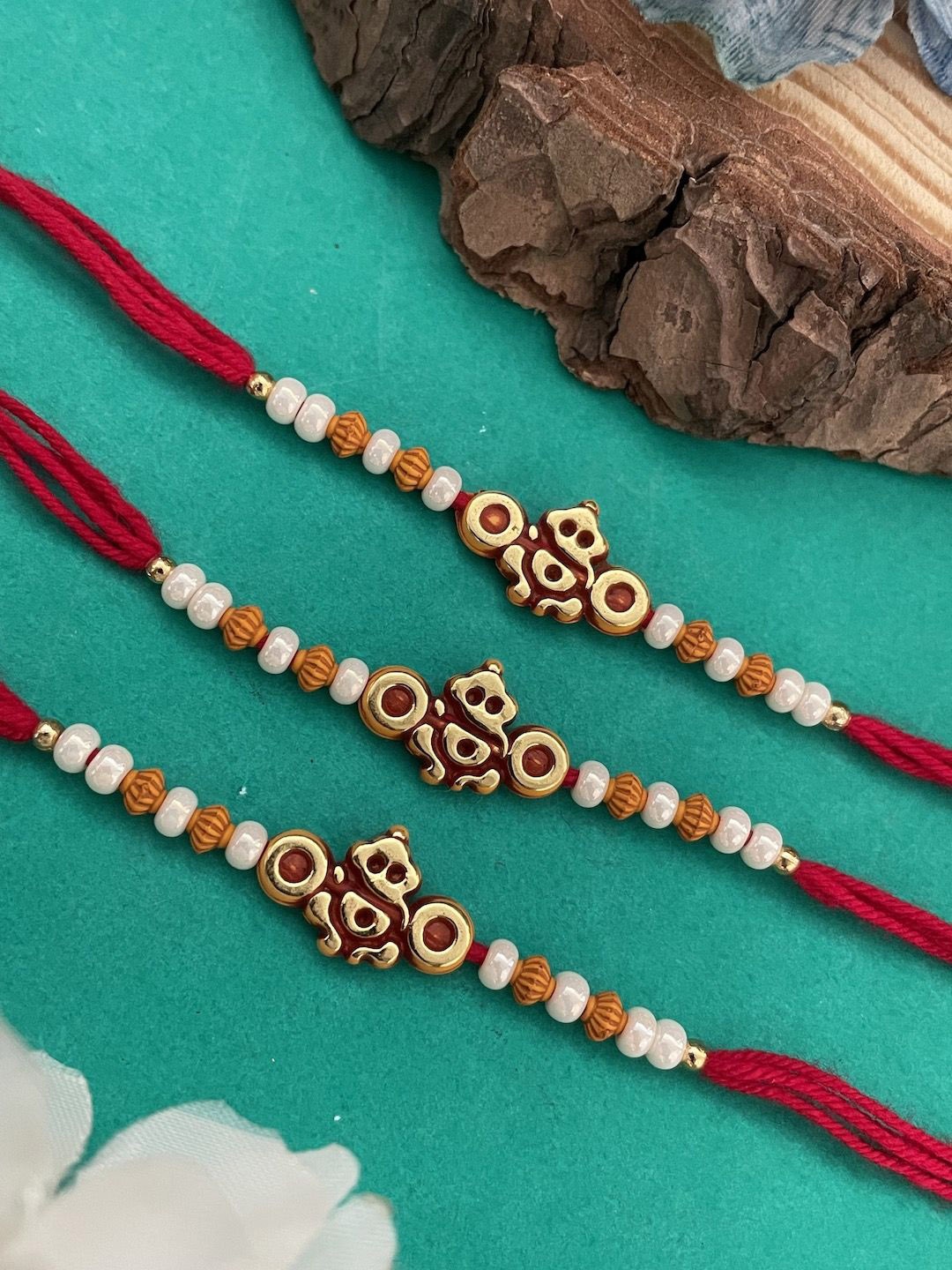 

Digital Dress Room Set Of 3 Pearls Beaded Lord Ganesha Thread Rakhis, Red