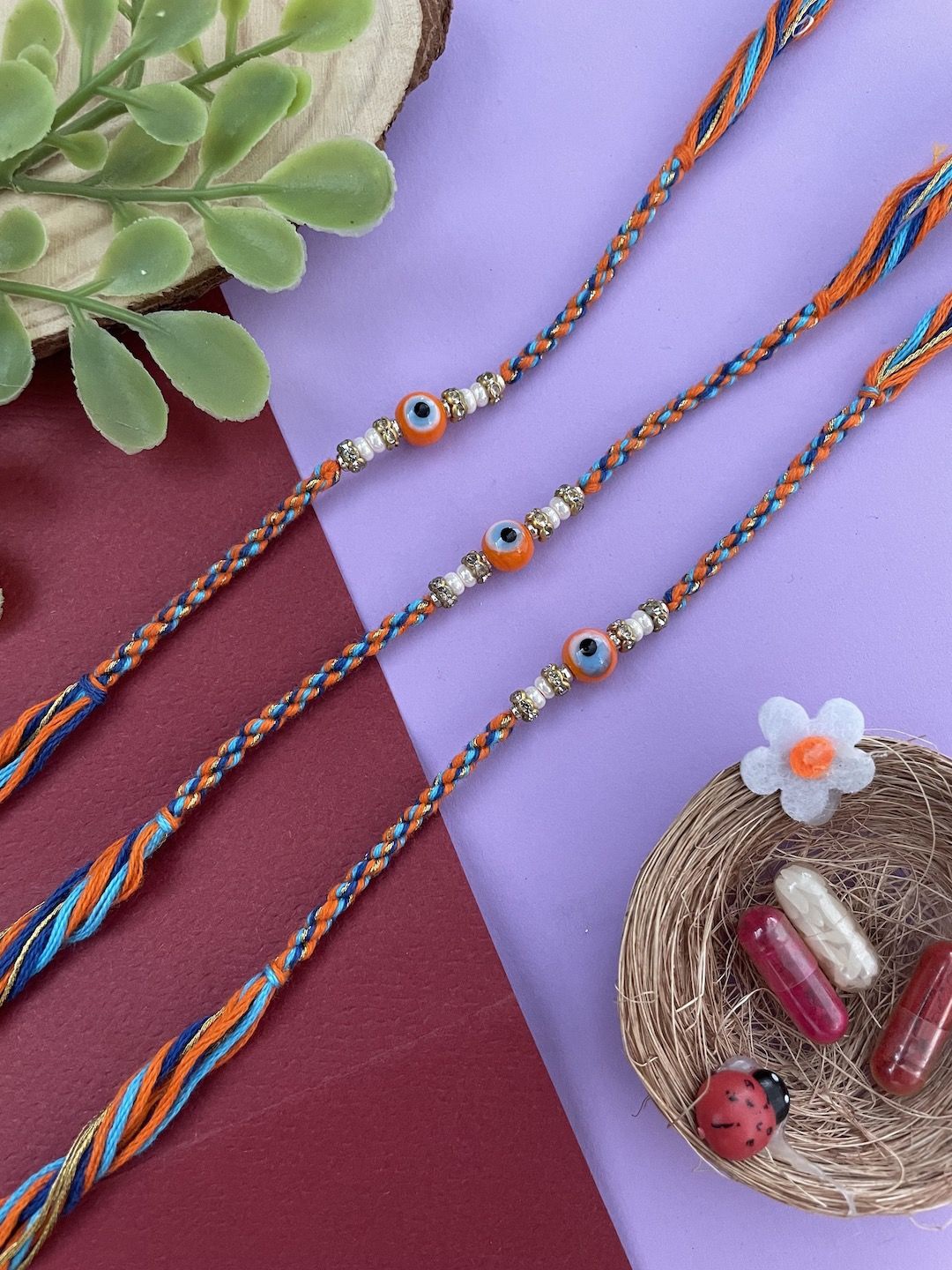 

Digital Dress Room Set Of 3 Evil Eye Pearls Beaded Thread Rakhis, Orange