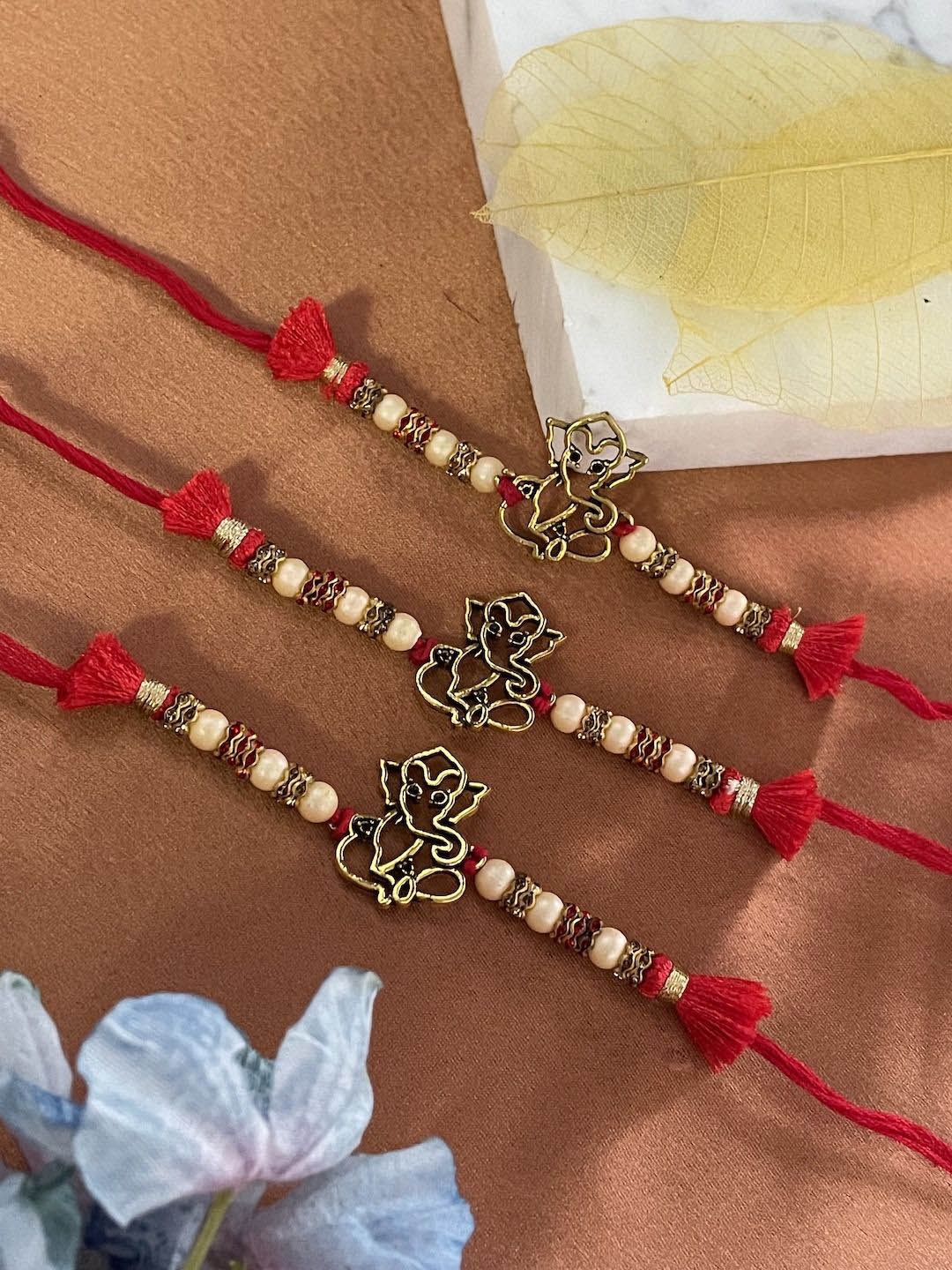 

Digital Dress Room Set of 3 Lord Ganesha Beaded Thread Rakhis, Gold