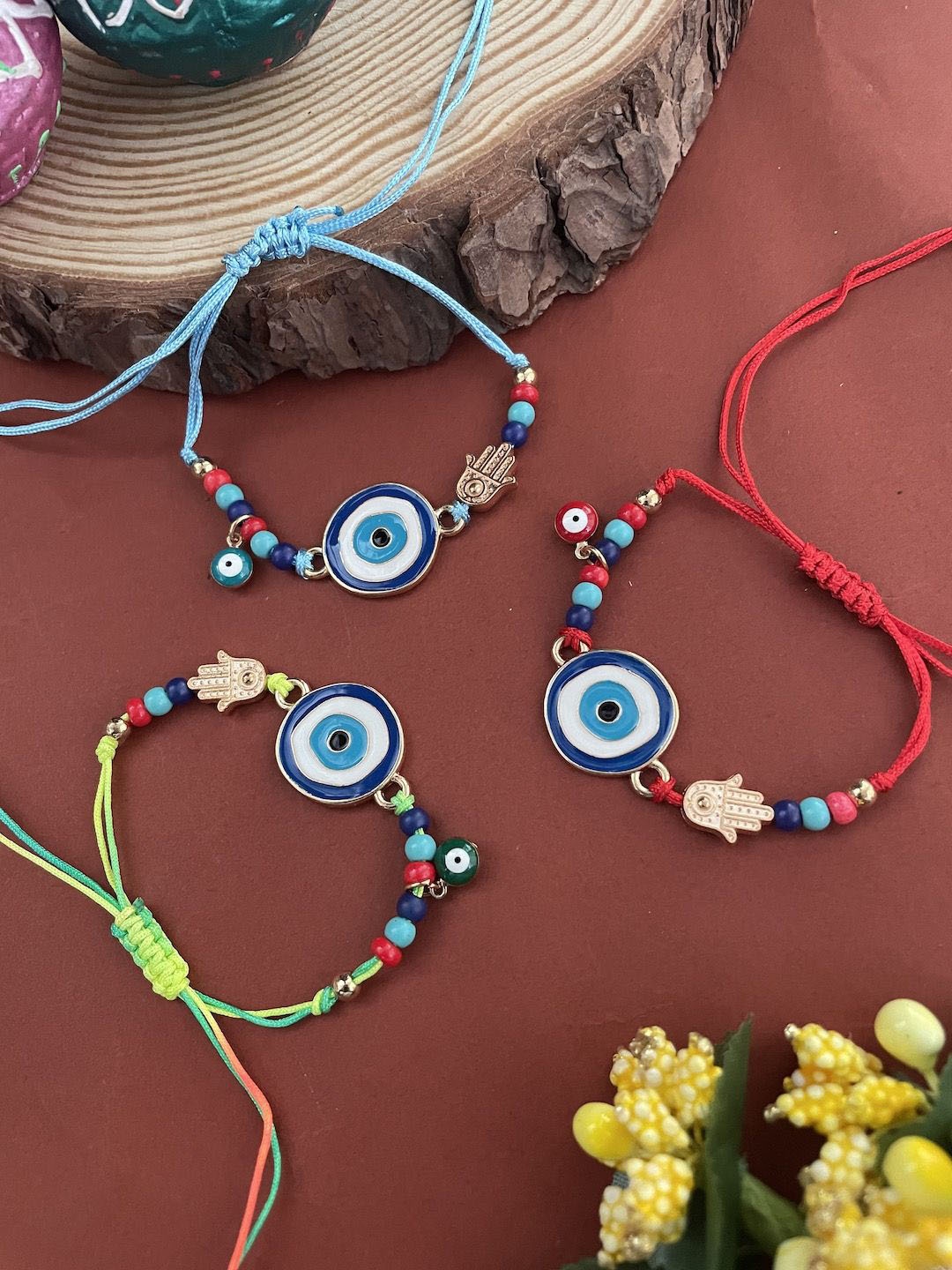 

Digital Dress Room Set Of 3 Evil Eye Beaded Thread Rakhis, Blue