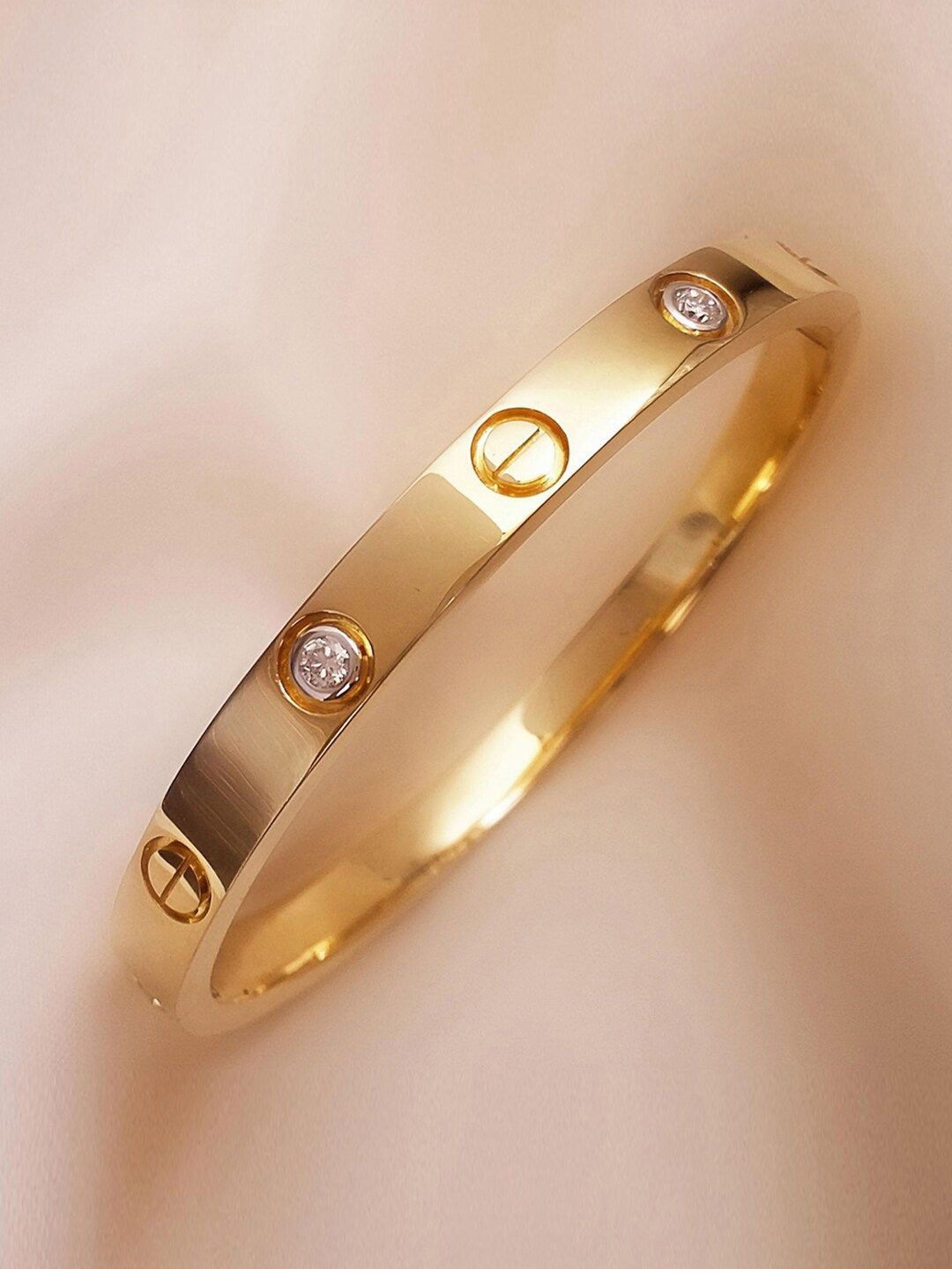 

DressBerry Gold-Plated American Diamond Stone Studded Bangle-Style Bracelet