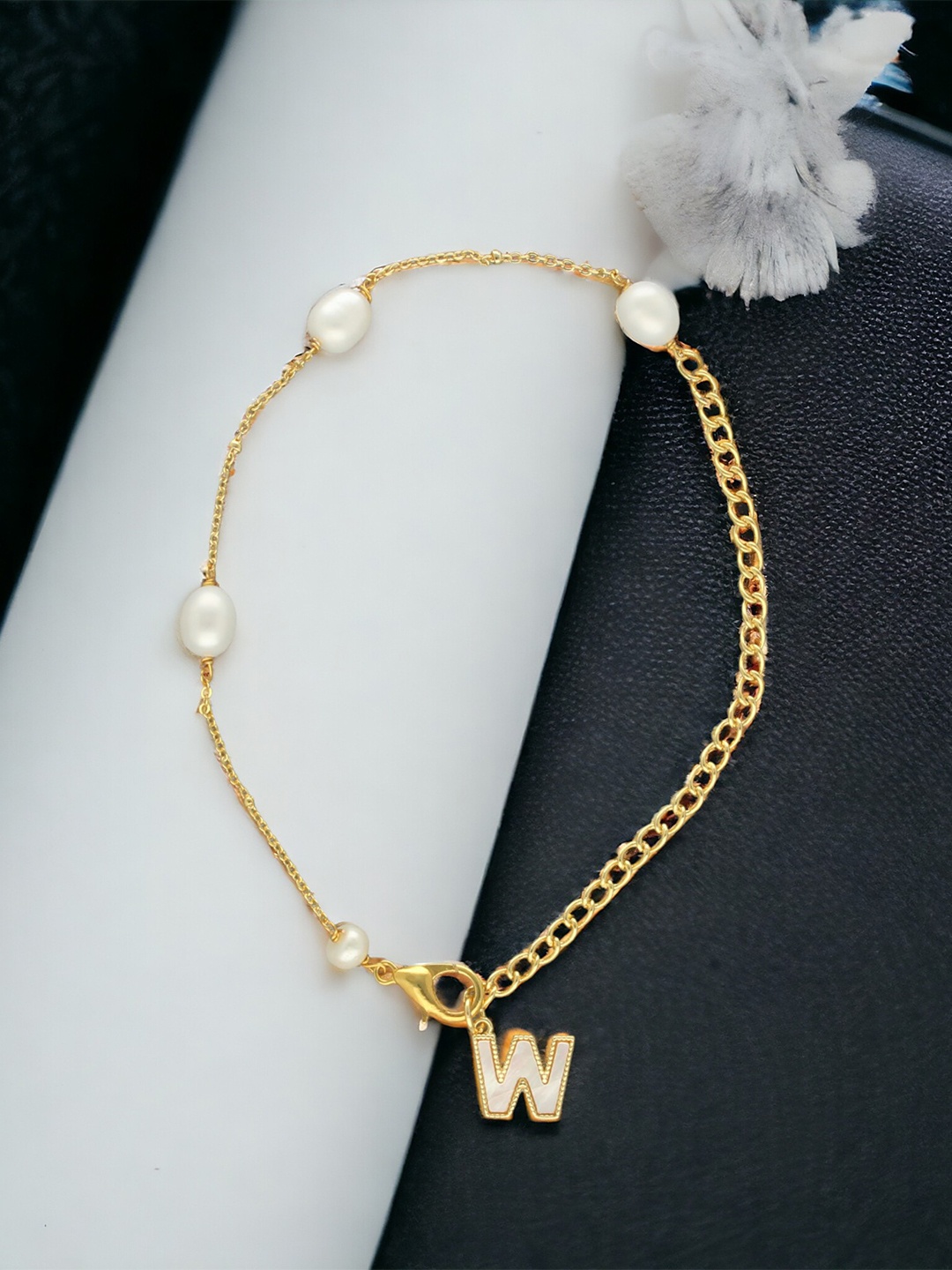 

Sri Jagdamba Pearls Dealer Gold-Plated Mother of Pearl Studded W Alphabet Charm Bracelet