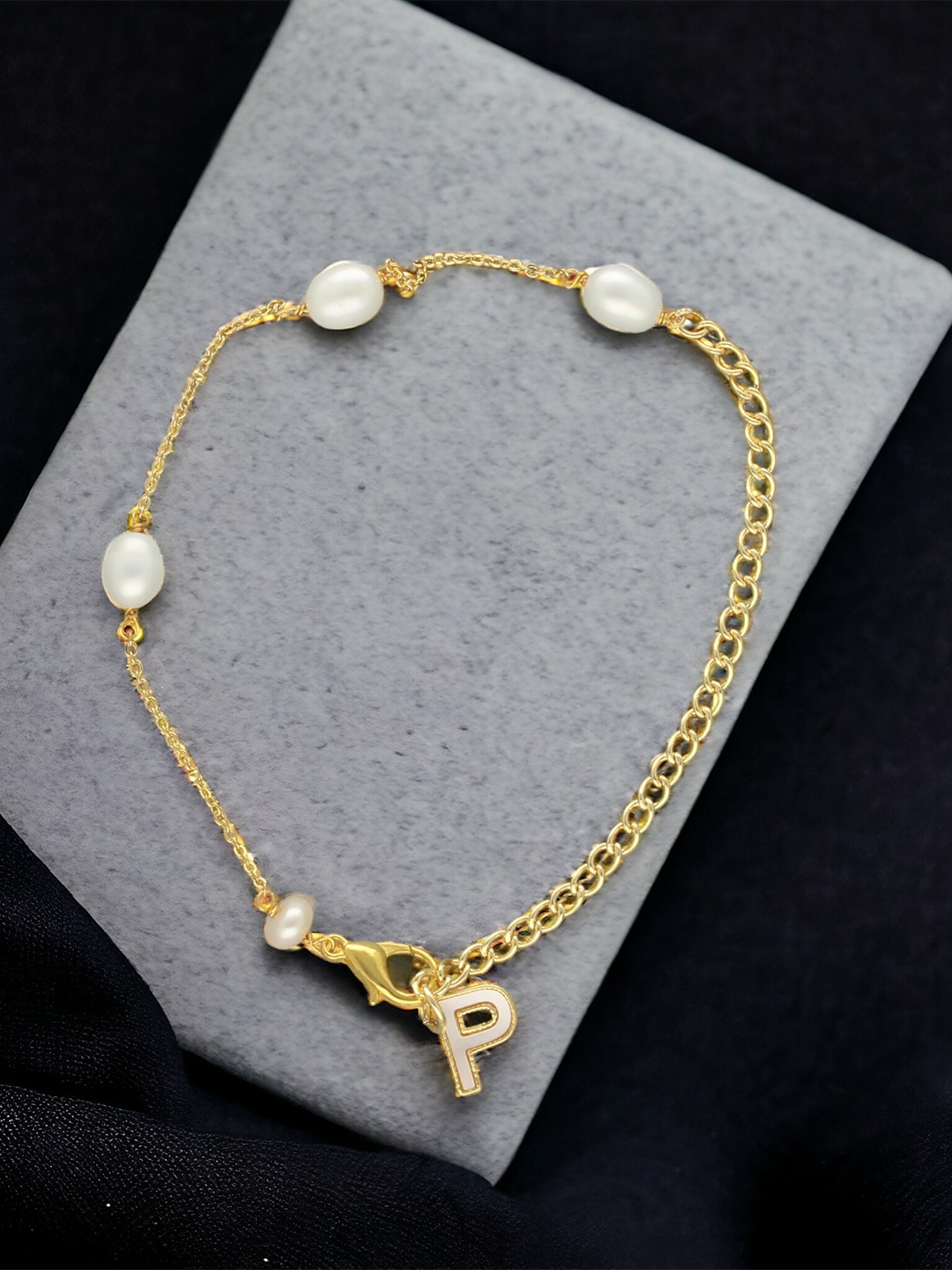 

Sri Jagdamba Pearls Dealer Gold-Plated Mother of Pearl Studded P Alphabet Charm Bracelet