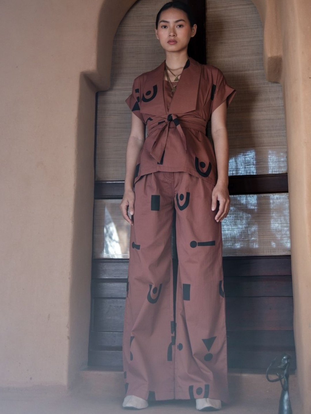 

The Terra Tribe Women Printed Relaxed Flared Mid-Rise Regular Trousers, Copper