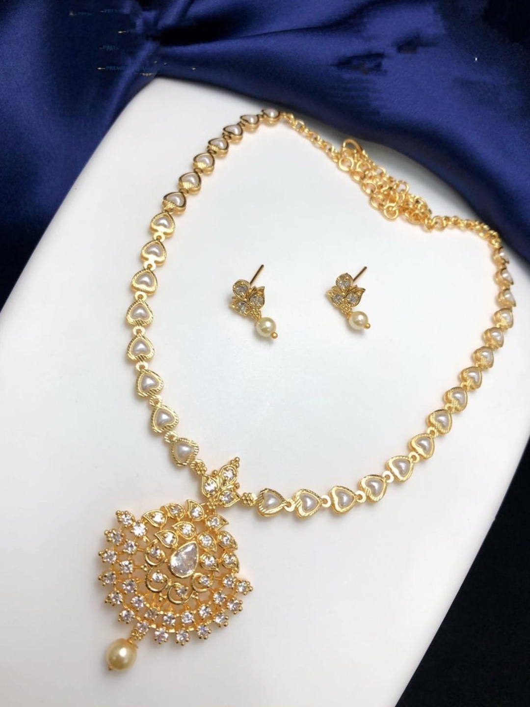 

Adc fashions Gold-Plated Stones-Studded & Pearl-Beaded Jewellery Set