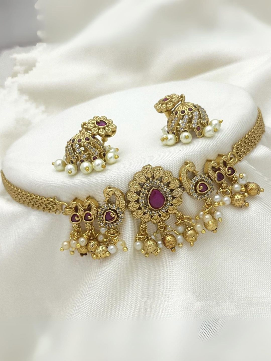 

Adc fashions Gold Plated Stones Studded & Pearls Beaded Peacock Jewellery Set