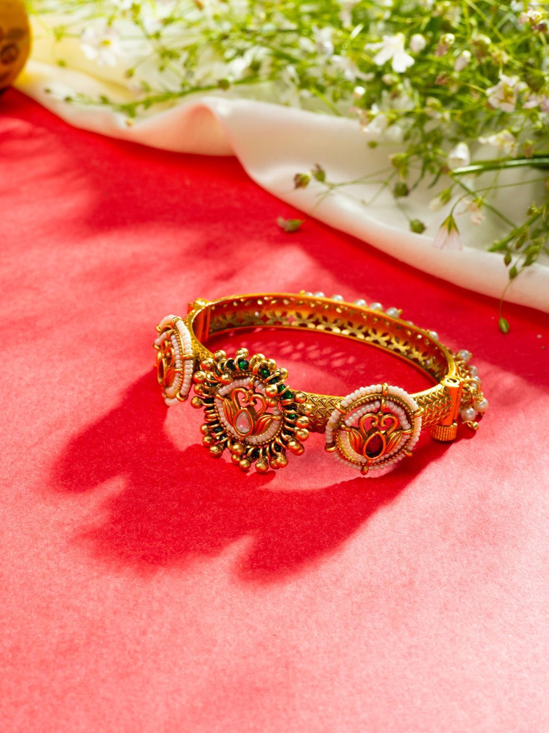 

Niscka Gold Plated Stone Studded Bangle Style Bracelet